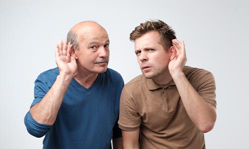 two males in different generations with hearing loss